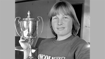 image of woman with trophy
