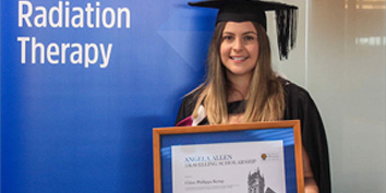 woman holding degree certificate